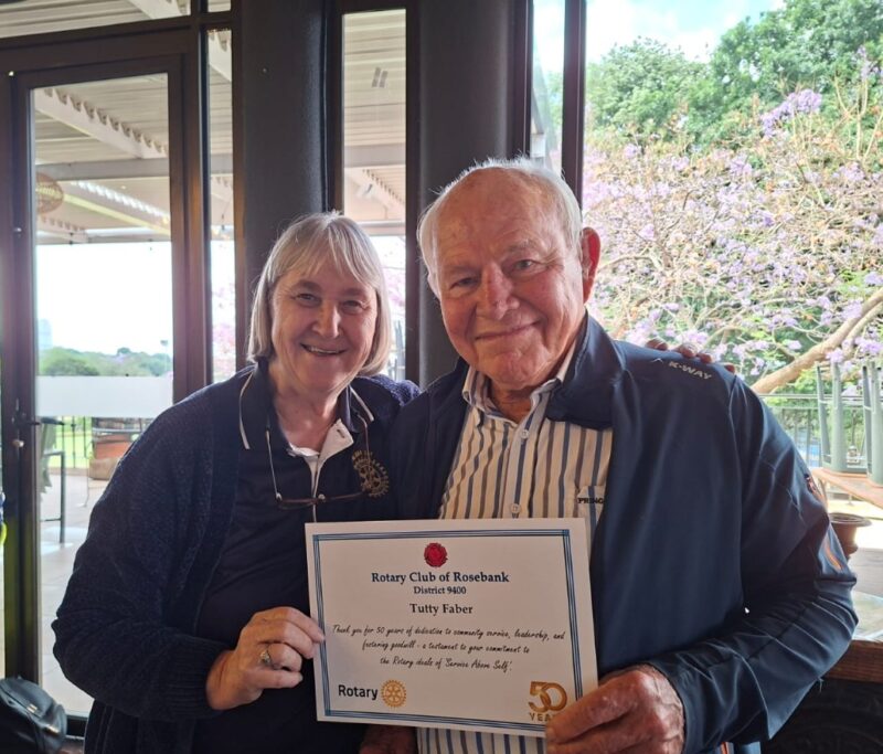 Rosebank Rotary Club President Margaret Stafford, alongside Rotarian Tutty Faber, who has been part of Rotary for half a century, receives a certificate of recognition on October 31, 2025, at the Wanderers Club. Photo: Supplied