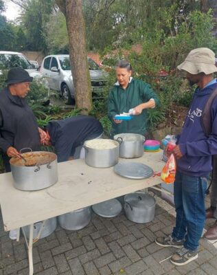 Cross the Divide volunteers dish out food in June 2025. Photo: Supplied