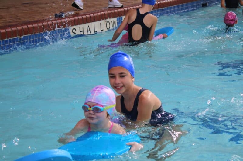 Fresh faces, helping hands and determined strokes filled the pool as learners swam together to support children who need it most.