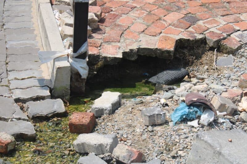 Illovo’s 10-year-old pipe leak has eroded the road.