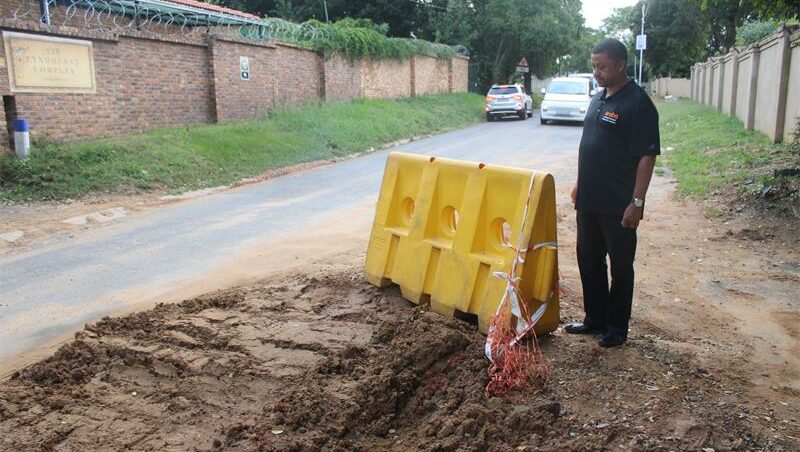 The excavation outside Louw's gate means mud washing down into his yard after heavy rainfall.