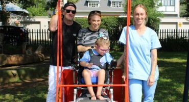 Lily with her parents, Sean and Robyn, and disabailty and support specialist, Erin Davis, at George Hay Park in Parkview on March 27, 2026. Photo: Naziya Davids-Easthorpe