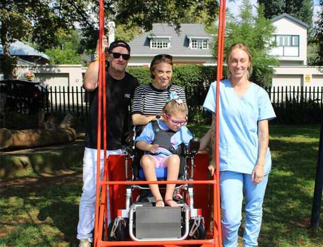 Lily with her parents, Sean and Robyn, and disabailty and support specialist, Erin Davis, at George Hay Park in Parkview on March 27, 2026. Photo: Naziya Davids-Easthorpe