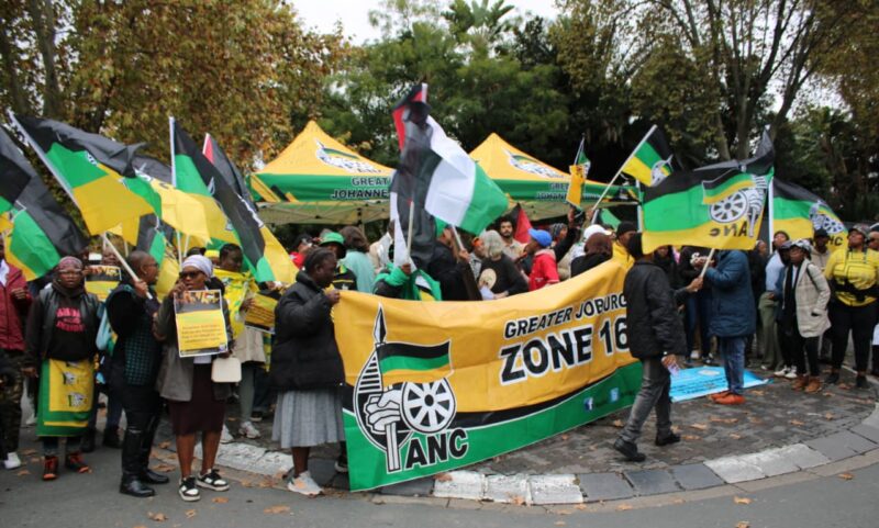 Supporters gather in protest after a visitor, Louis Seeco, was banned for displaying a Palestinian flag on his car.