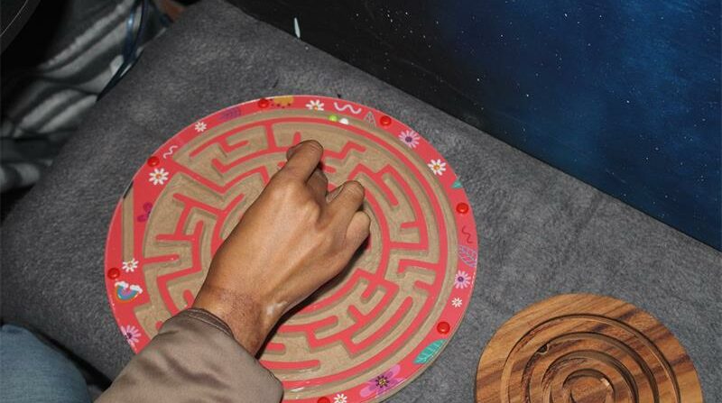An adult plays a hand and eye co-ordination game on May 13, 2026. Photo: Asanda Matlhare