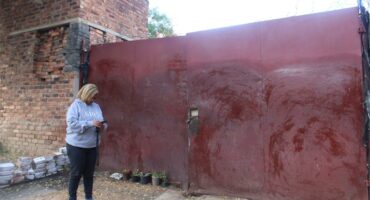 Ward 74 councillor, Belinda Kayser-Echeozonjoku stands outside the hijacked property in Highlands North on May 18, 2026. Photo: Asanda Matlhare