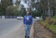 Ward 72 Councillor Daniel Schay stands next to the eroded part of Modderfontein Road on June 23, 2026. Photo: Asanda Matlhare