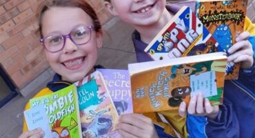 Jasmine Rymer and Lilith Saunders are delighted with the pre-loved books on May 25, 2026. Photo: supplied