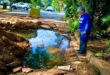 Ward 73 councillor, Eleanor Huggett surveys the flooded excavation in Orange Grove on June 3, 2026. Photo: Asanda Matlhare