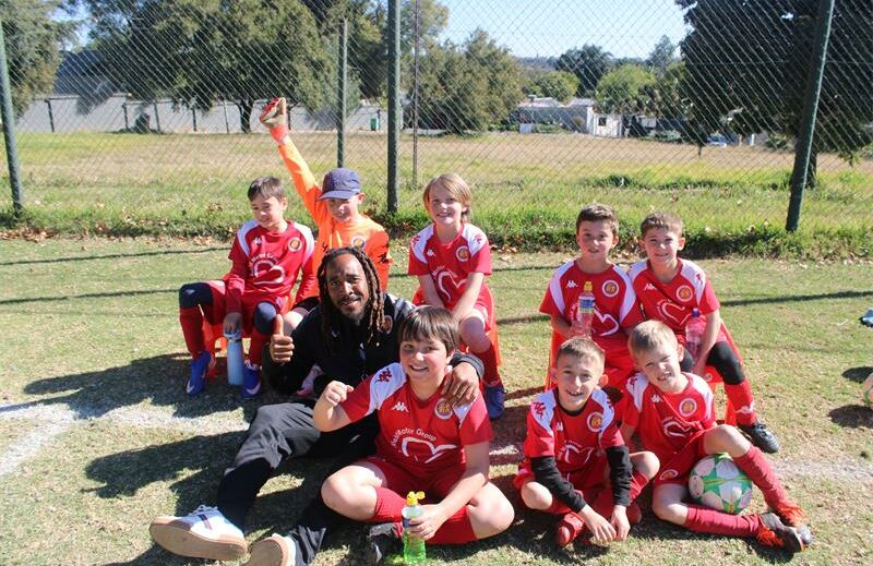 Coach Loyiso Mkutu and his team, Highlands Park FC, after the junior football game at Highlands Park Football Club on July 5, 2026. Photo: Thato Modopi