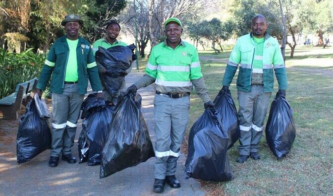 CAP green team carries filled refuse bags on Mandela Day on July 18, 2026. Photo: Asanda Matlhare