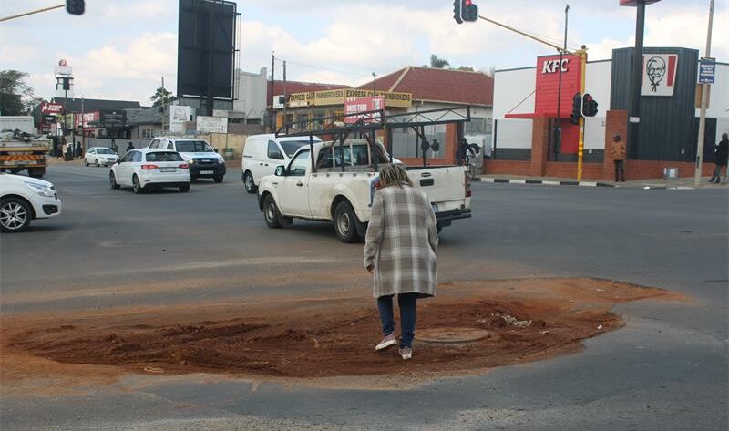 Ward 74 councillor Belinda Kayser-Echeozonjoku stands on a forgotten reinstatement in Louis Botha Avenue and Athol Street on June 22, 2026. Photo: Asanda Matlhare