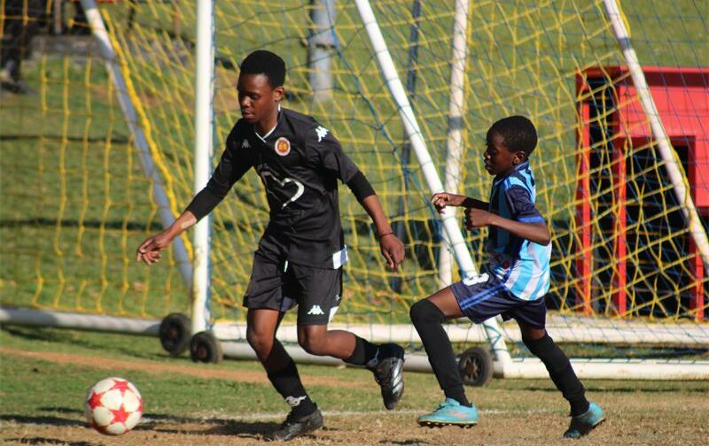 U13 Highlands Park player, Andile Tembe leads with the ball on June 28, 2026. Photo: Asanda Matlhare