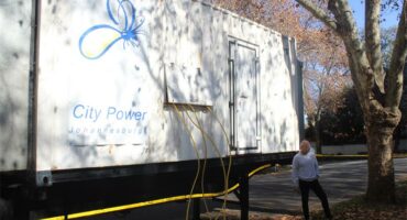 Sapra co-chairperson Danie Griffith stands by the generator, Parkwood’s temporary light solution.