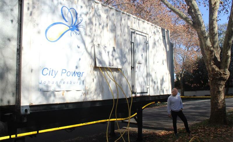 Sapra co-chairperson Danie Griffith stands by the generator, Parkwood’s temporary light solution.