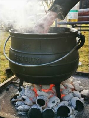 A potjiekos pot over the coals. Photo: supplied