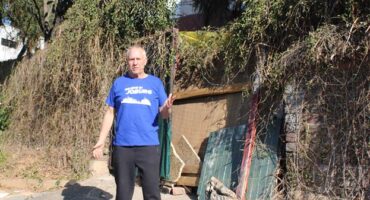Ward 117 councillor Tim Truluck stands in front of the makeshift gate at the depilated property in Parktown. Photo: Asanda Matlhare