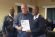 Bramley SAPS station commander Colonel Chetty and Lieutenant Colonel Thapelo Molepo present Warrant Officer Jacques De Jager with a certificate of recognition for his hard work on July 29. Photo