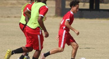 BSI Football Academy player Giovanni Ferrera leads with the ball on August 21, 2026. Photo: Asanda Matlhare