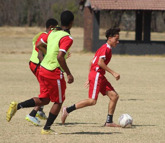 BSI Football Academy player Giovanni Ferrera leads with the ball on August 21, 2026. Photo: Asanda Matlhare