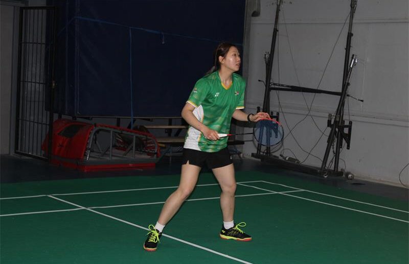 Badminton player Emily Li stands midcourt ready for the shuttlecock on August 23, 2026. Photo: Asanda Matlhare