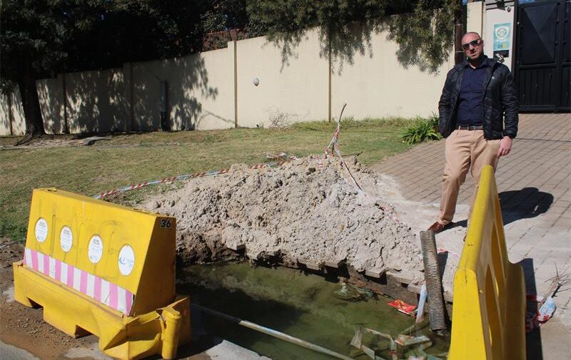 Ward 72 councillor David Schay observes a flooded excavation on July 2, 2026. Photo: Asanda Matlhare