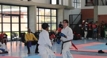 Bohlale Ngakane and Riccardo Bonaretti battle it out on the mat during the karate fighting division on July 25, 2026. Photo: Thato Modopi