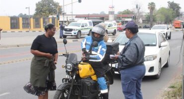 Captain Bridget Kgomotso Dladla and Captain Thoko Mdaka-Thoka speak to a motorcyclist during Bramley SAPS’ Operation Basadi on Pretoria Main Road. Photo: Thato Modopi