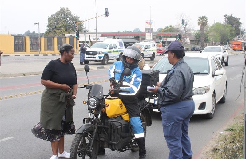 Captain Bridget Kgomotso Dladla and Captain Thoko Mdaka-Thoka speak to a motorcyclist during Bramley SAPS’ Operation Basadi on Pretoria Main Road. Photo: Thato Modopi
