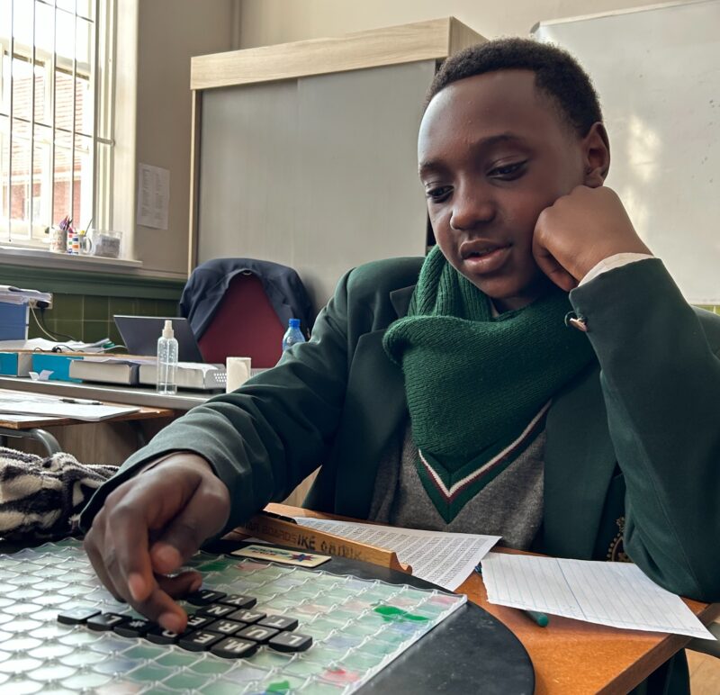 Chuka Obidike thinks of the next word to form on the Scrabble board on August27, 2026. Photo: Asanda Matlhare