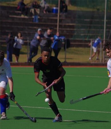 Parktown's Dalindyebo Tsengiwe makes a run for it during the first side's hockey game on Saturday, July 25.