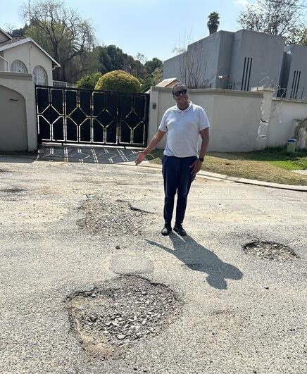 Community leader, Theo Lengwati shows the poor state of Crystal Road in Bramley on August 28, 2026. Photo: Asanda Matlhare