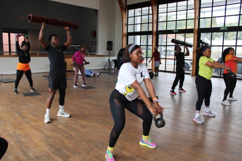 Community members braved the cold for an early morning workout in Norwood, taking part in routines led by local fitness enthusiasts.