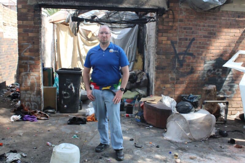 City entities descend on a suspected hijacked property on Raglan Street as municipal investigators attempt to trace the owners.