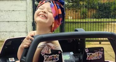 Reach For A Dream beneficiary Dianty da Silva rides her fancy car. Photo: Supplied