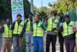 Team members of the Pave the Way community initiative work to clean and restore pavements along major routes like Jan Smuts Avenue, providing employment and purpose for displaced individuals. Photo: Naziya Davids-Easthorpe