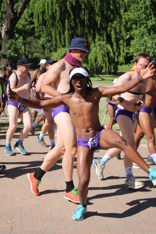 A participant enthusiastically poses for a selfie while on the move during the Hollard Daredevil run at Zoo Lake on October 23, 2026. Photo: Naziya Davids-Easthorpe