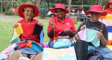 Mogapi Mphahlele, Patricia Mphephu and Onica Mkhwanazi crochet squares on October 27, 2026. Photo: Asanda Matlhare