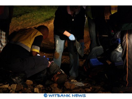 Paramedics from Langamed Emergency Management tend to the seriously injured man.