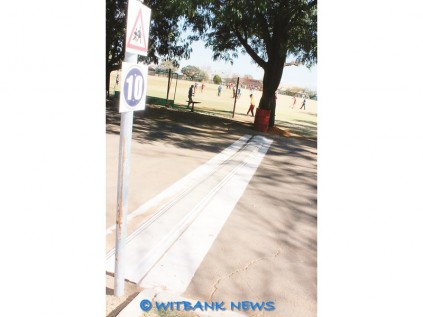 A cost effective way of erecting a speed hump can be seen at Hoërskool Generaal Hertzog, these conveyer-belt speed humps is effective.