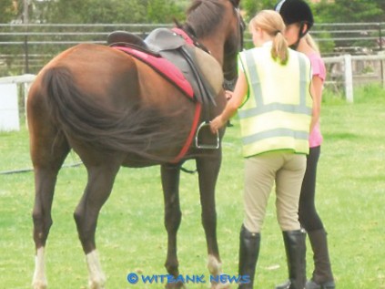 Witbank Pony Club instructor, Maritha Duvenage, explains a safety tip to Phoebe Doms.