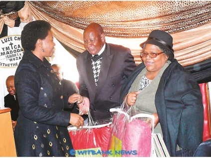 Executive mayor of Emalahleni hands blankets and present to Bishop Josiah Langa and his wife Johanna of the Luze Great Church in Hlalanikahle recently.
