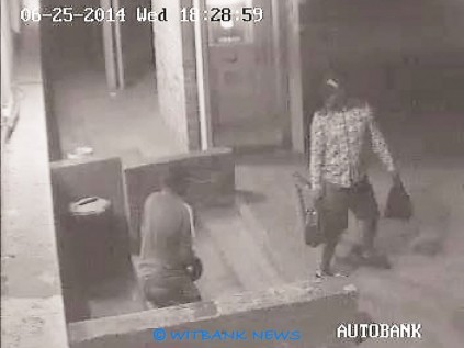Carrying packets filled with cigarette boxes, the robbers left the garage.