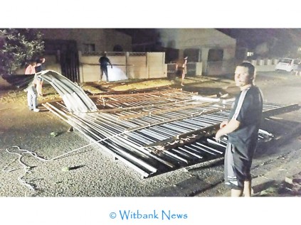 A garage door blew off and landed in the road on Thursday evening, October 9.
