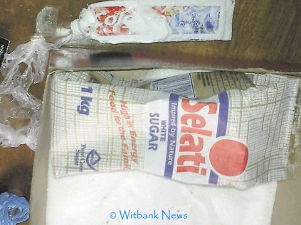 The packet of sugar and the toothpaste tube in which drugs were smuggled.
