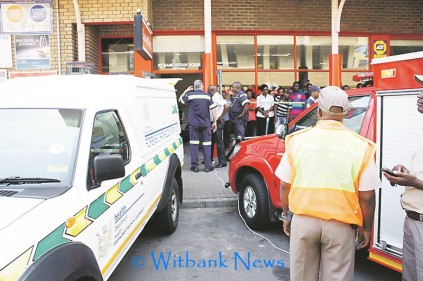 Emergency services spent over an hour trying to get the body out of the elevator shaft.
