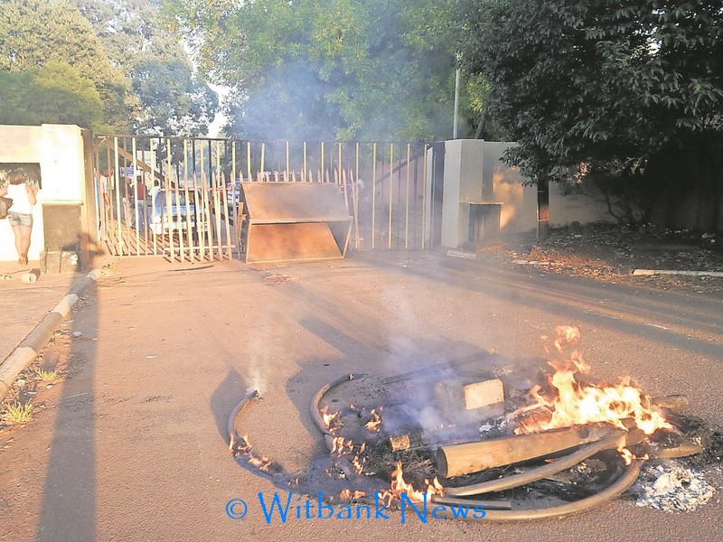 A bin was used to block one of the gates to nearby villages, preventing residents from leaving the village.
