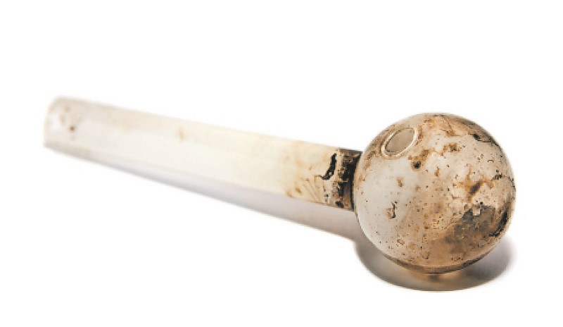 An example of a rock smoking pipe made out of a tot bottle.