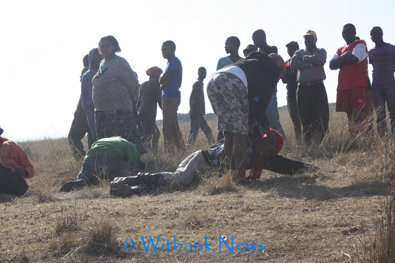 A family member cried when his body was brought towards the river edge.