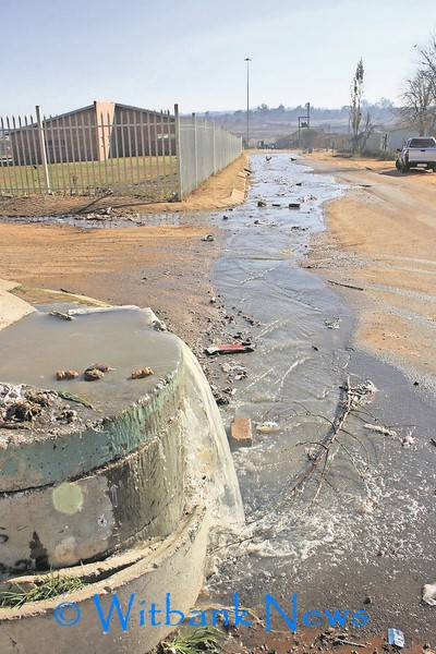 Sewerage water and faeces flowing down the road in Vosman.